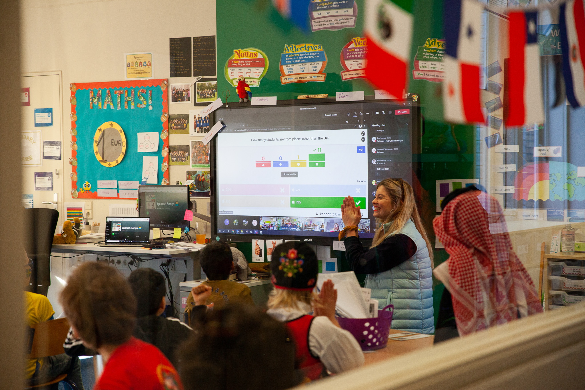 junior school diamanthorst students participate in an online kahoot quiz during international assembly